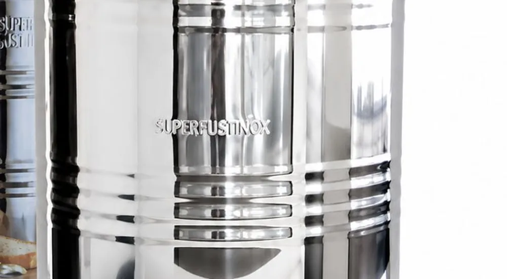 Close-up of the Milano drum's polished stainless steel body and ribbed weld construction